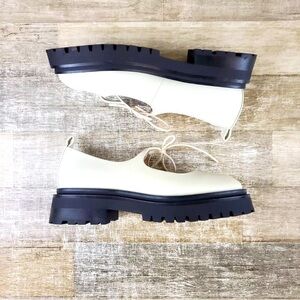 Elegant Cream Loafers with Black Soles